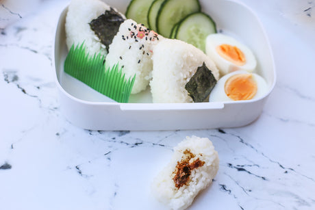 Onigiri Filling with Bite taken out Bento Background